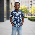 Young Nigerian boy wearing navy blue floral print shirt