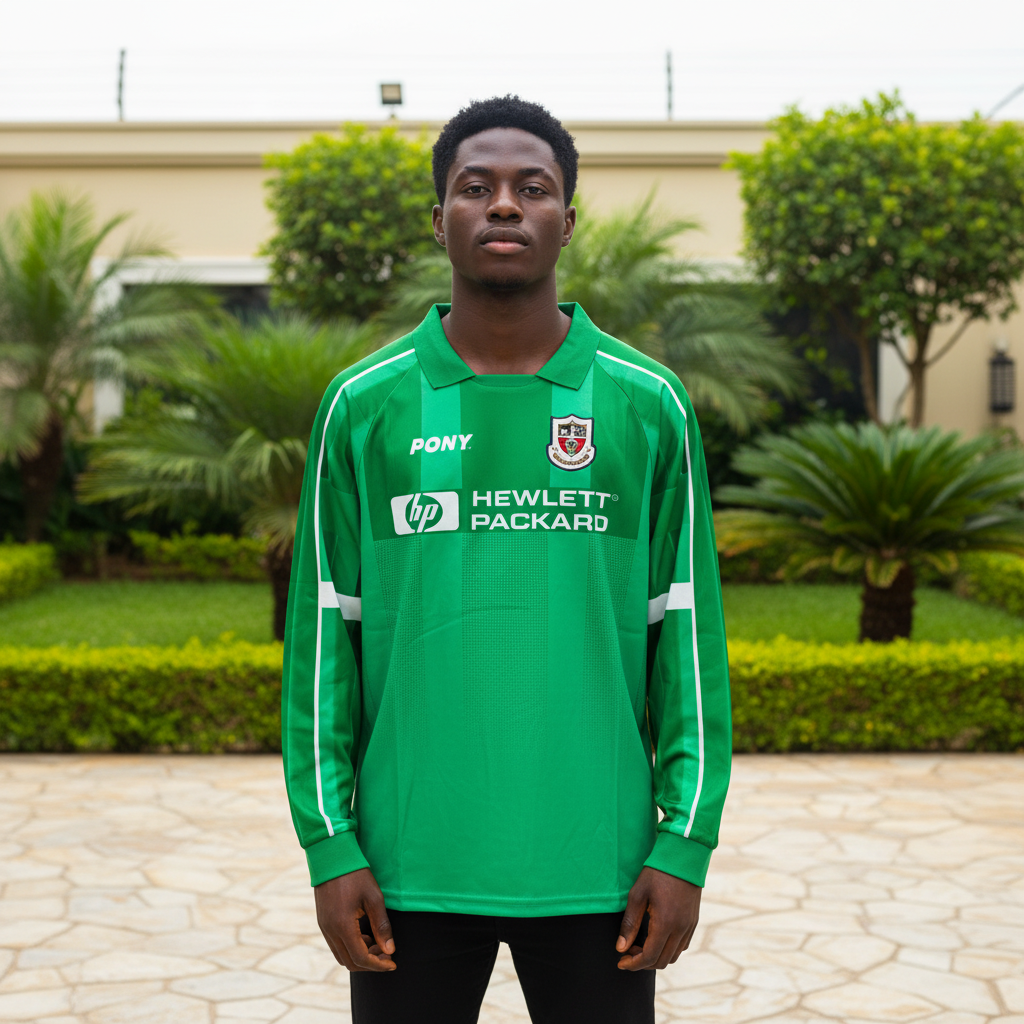 Green long-sleeve retro football jersey with white piping and polo collar — Nigerian male model front view