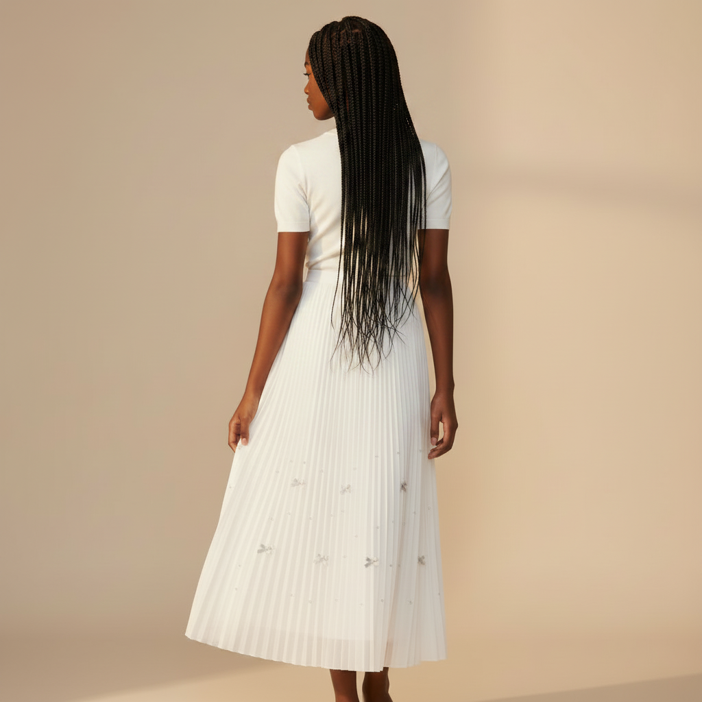 Nigerian girl wearing white bow pleated midi skirt - back view