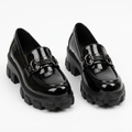 Complete pair of black glossy ring-detail chunky loafers on a white background