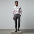 Nigerian male model wearing white floral leaf print long-sleeved shirt, front view