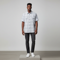 Nigerian male model wearing grey and white plaid short-sleeved shirt
