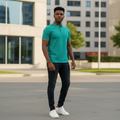 Young Nigerian male model wearing teal polo shirt with rainbow tipped collar and cuffs