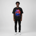 Man wearing the black Be Your Own Hero graffiti tee