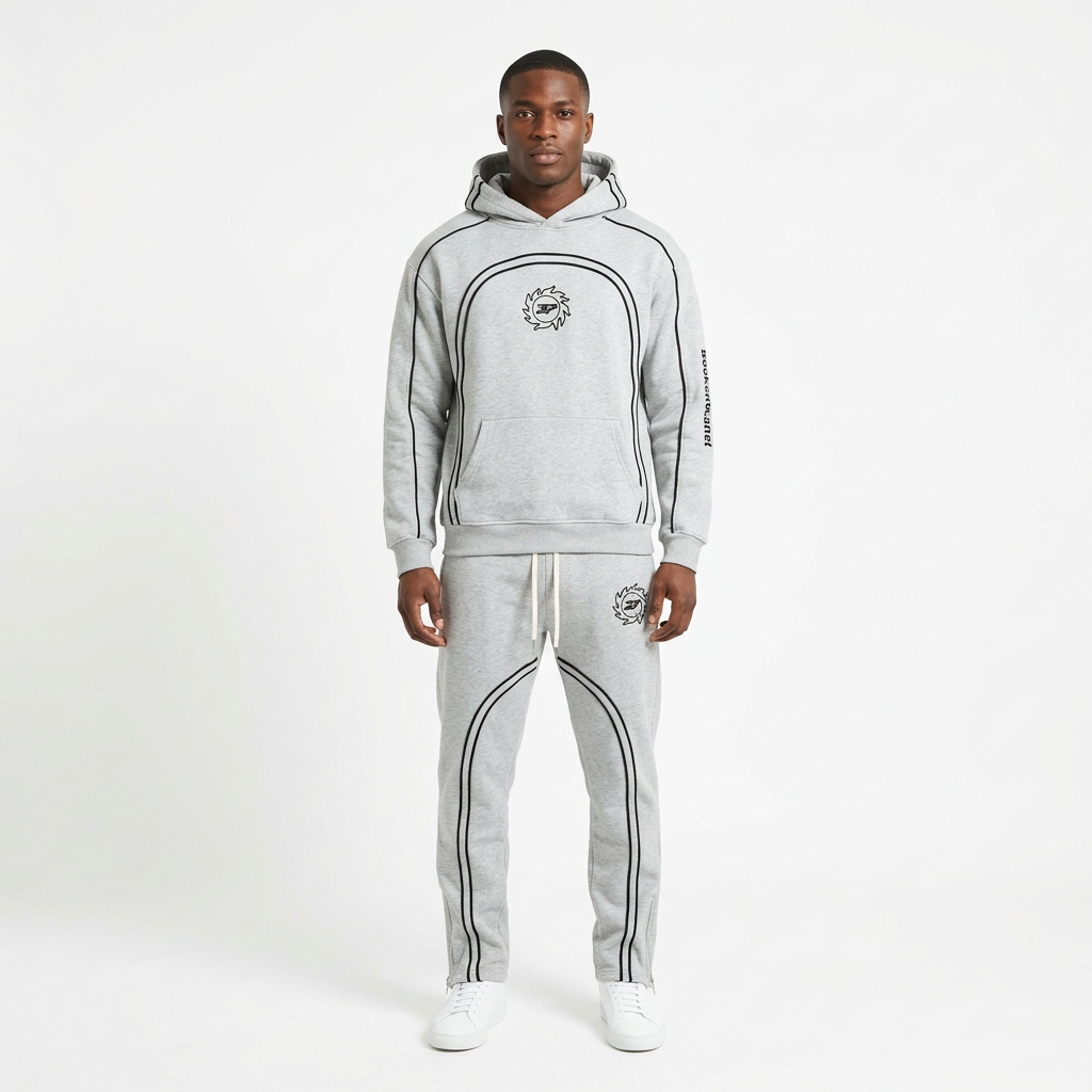 Adult Black model wearing a light-grey curved-piping hoodie and jogger set