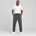 Model wearing charcoal drawstring training trousers