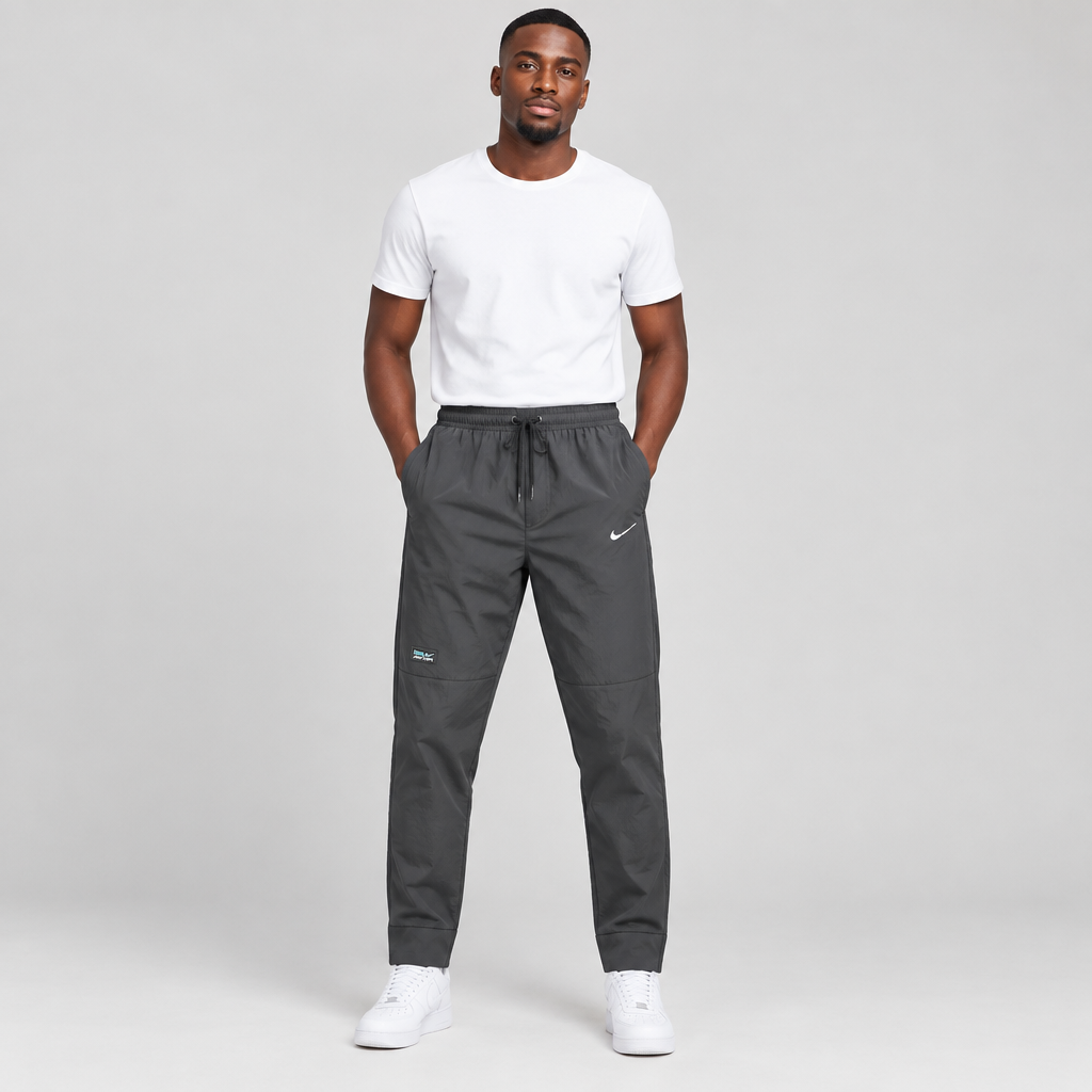 Model wearing charcoal drawstring training trousers