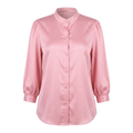 Pink textured band-collar blouse on an invisible mannequin