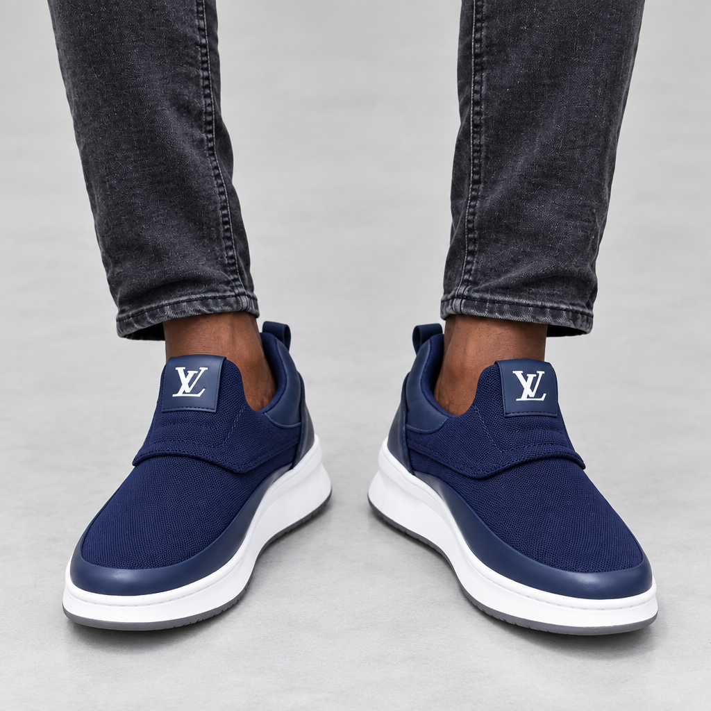 Navy fabric slip-on trainers worn with charcoal jeans