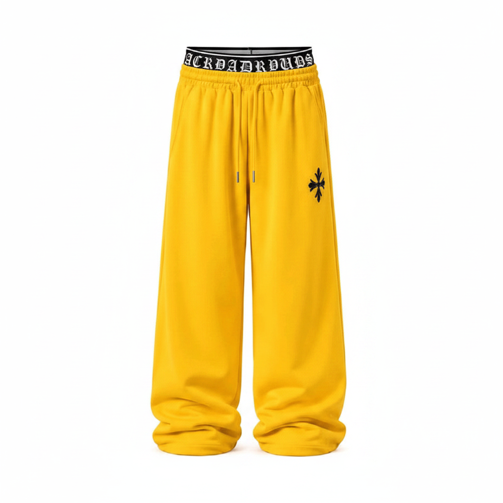 Men's yellow wide leg cross emblem sweatpants ghost mannequin front view
