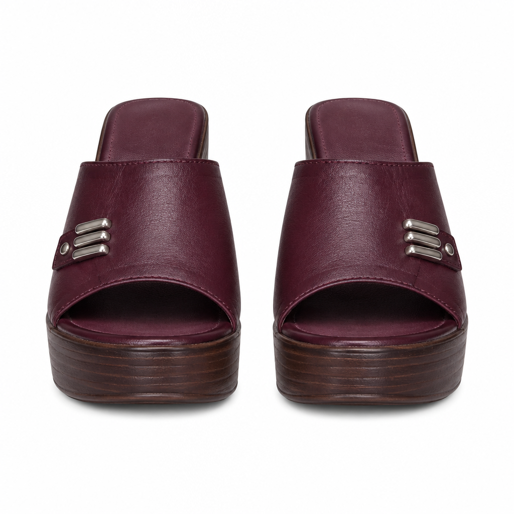 Maroon platform clog mules with a three-bar metal trim on the strap, full pair shown straight-on from the front