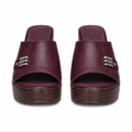 Maroon platform clog mules with a three-bar metal trim on the strap, full pair shown straight-on from the front