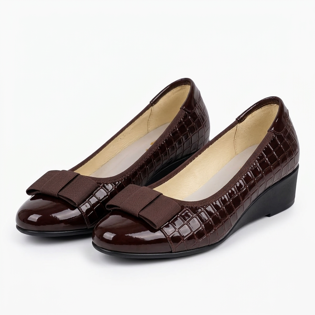 Matching burgundy-brown croc-embossed bow wedge shoes