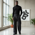 Wide-leg belted pleated trousers in black worn by male model