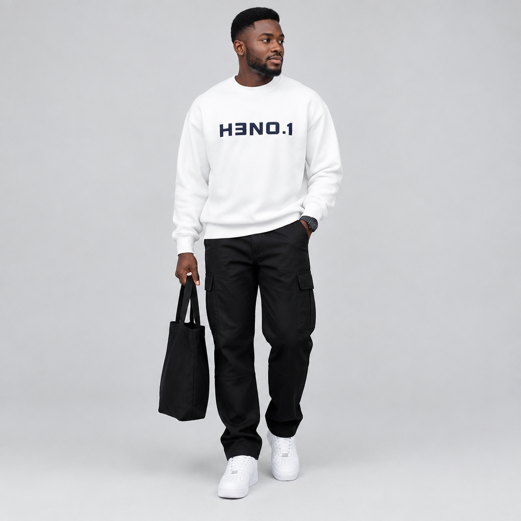 Black male model wearing a white text print sweatshirt