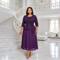 Black woman wearing plum peplum occasion dress