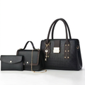 Black three-piece handbag set without label with embossed tote, flap bag and pouch on white