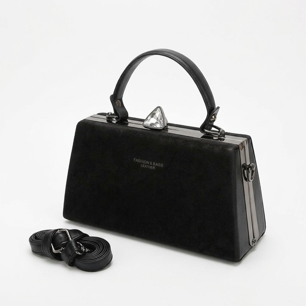Black structured top-handle handbag with matching detachable strap on a white background