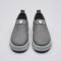 Men's grey slip-on sneakers with chunky platform sole, straight-on view of the pair