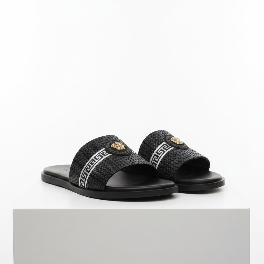 Men's black woven Greek key stripe slide sandals with gold medallion pair on white platform