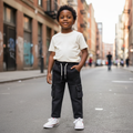 Young Nigerian boy wearing dark grey denim cargo jeans