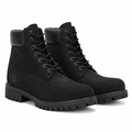 Pair of black padded-collar lug-sole boots on white