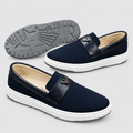 Navy textured slip-on shoes with black trim and white platform soles
