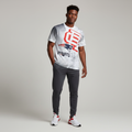 Young Nigerian male wearing white NFL New England Patriots all-over print tee