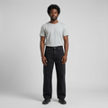 Full-body male model wearing black wide-leg jeans
