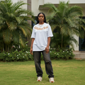Nigerian female model wearing white gothic calligraphy arc graphic tee – front view