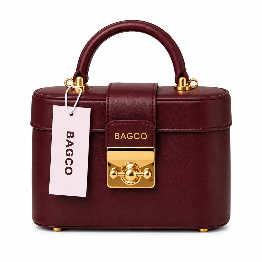 Oxblood structured box handbag with gold-tone clasp on white