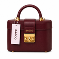 Oxblood structured box handbag with gold-tone clasp on white