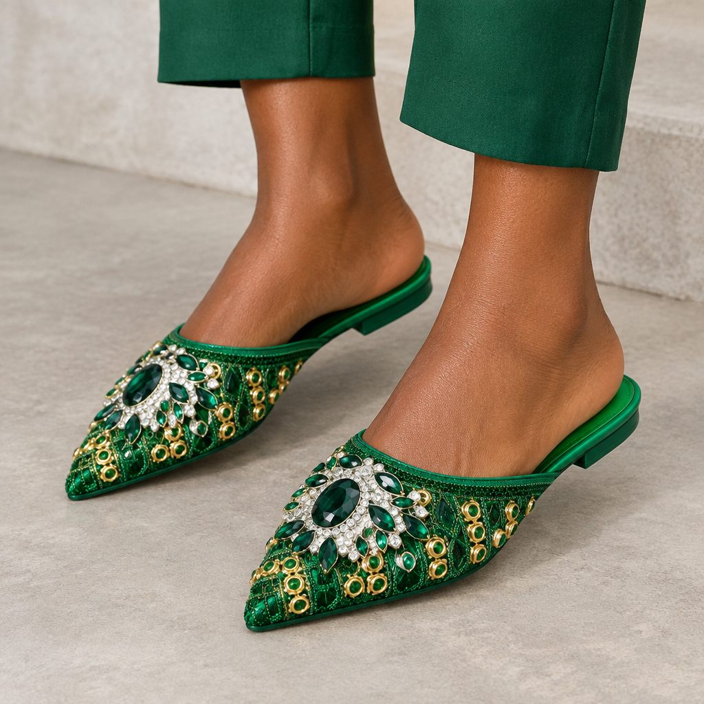 Green jeweled pointed mules worn on both feet