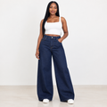 Young Black Nigerian woman wearing dark indigo wide-leg denim jeans
