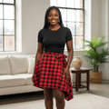 Nigerian woman wearing red and black plaid wrap skirt