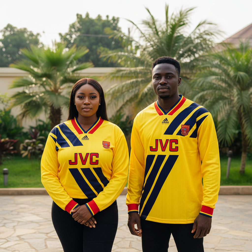 Nigerian female and male models wearing the yellow and navy diagonal-stripe long-sleeve retro football jersey