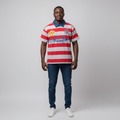 Model wearing the red and grey striped rugby polo shirt with jeans