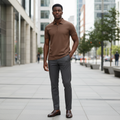 Young Nigerian male model wearing brown textured quarter-zip polo shirt