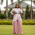 Nigerian female model wearing pink floral print top and dusty pink pleated palazzo trousers set