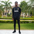 Black and gold stripe long-sleeve retro football jersey — Nigerian male model front view