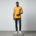 Nigerian male model wearing mustard yellow plain long-sleeved shirt, front view