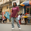 Young Nigerian teen wearing burgundy fantasy graphic oversized tee