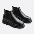 Black men's Chelsea ankle boots shown as a complete pair
