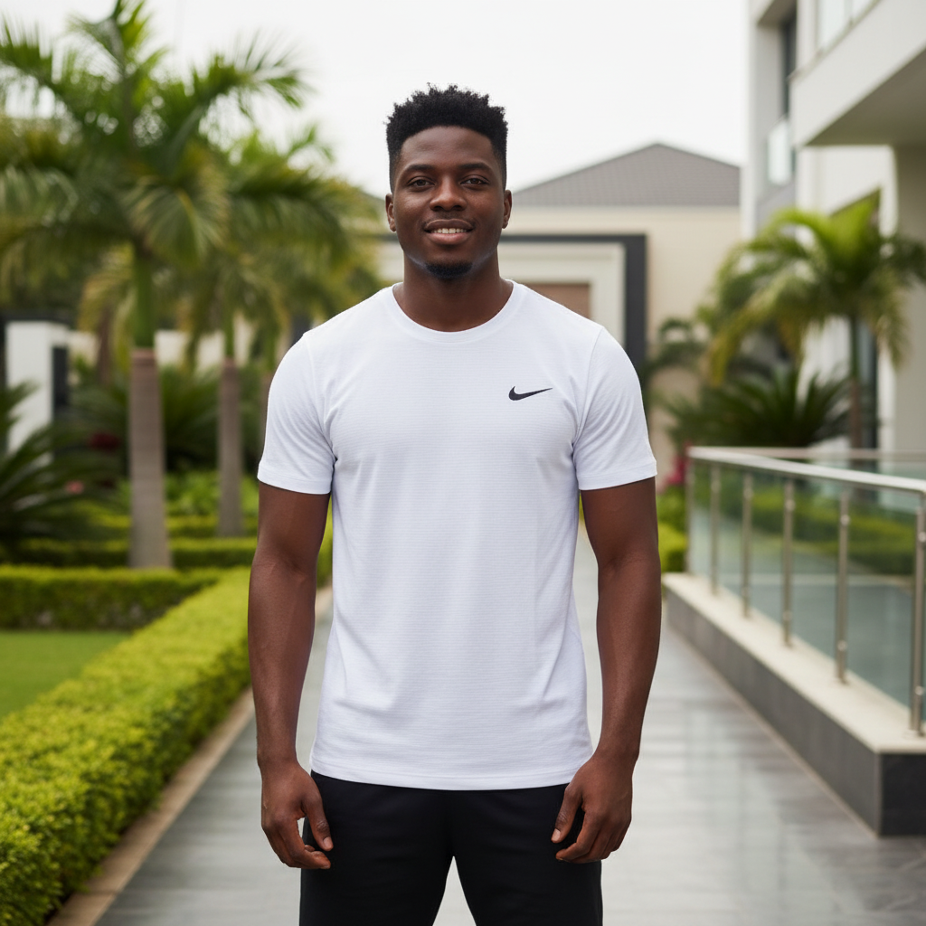 Nigerian male model wearing white athletic performance tee