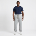 Adult Black model wearing light grey marl cuffed drawstring joggers
