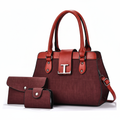 Wine red structured tote bag set with clutch and card holder on white background