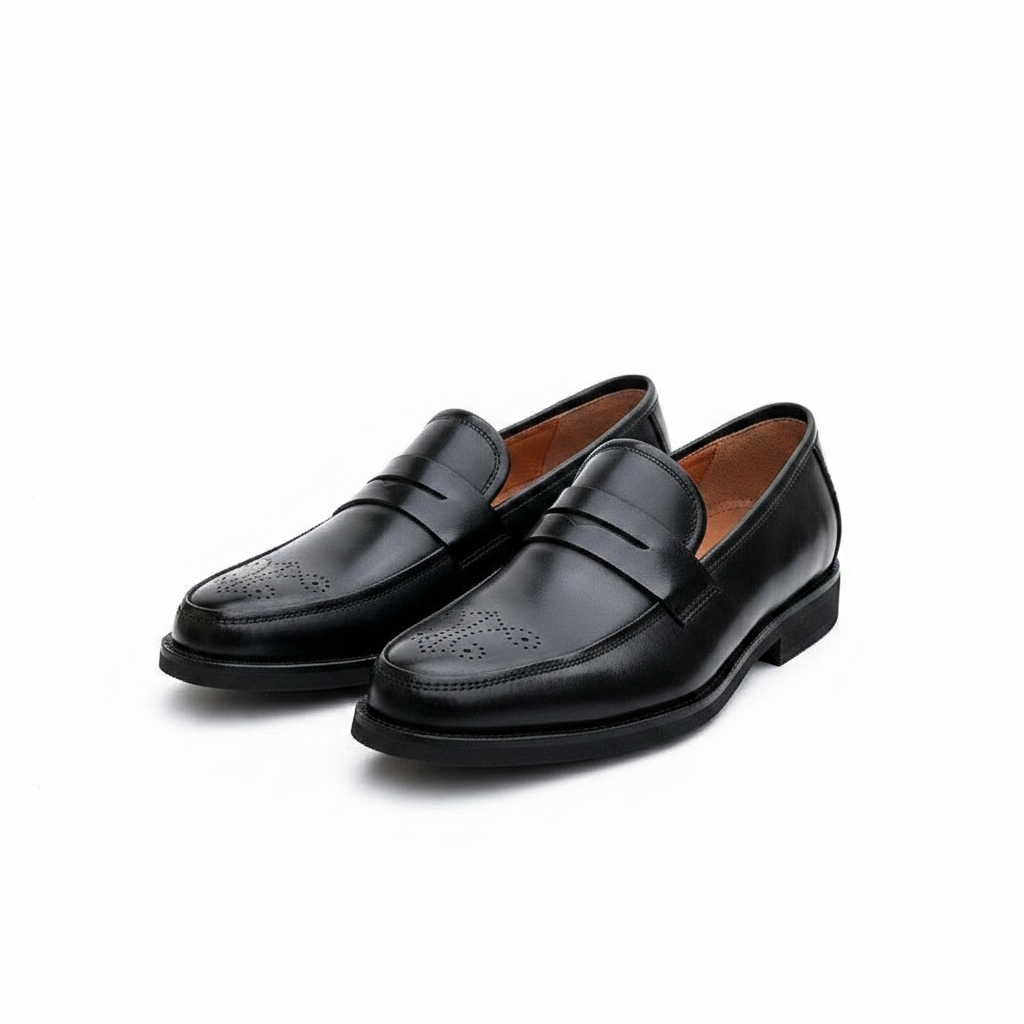 Men's black leather brogue toe penny loafer shoes pair on white platform