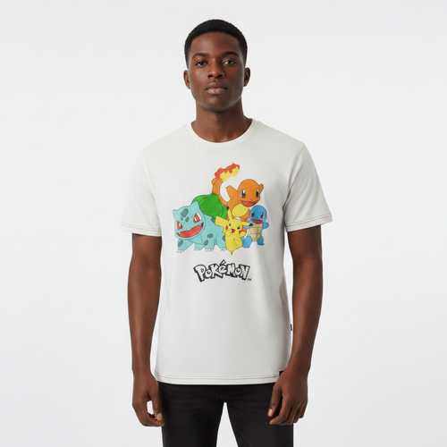 Young Nigerian male wearing vintage cream Pokémon starter squad graphic crew neck tee