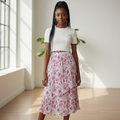 Nigerian teenage girl wearing white floral pleated tiered midi skirt