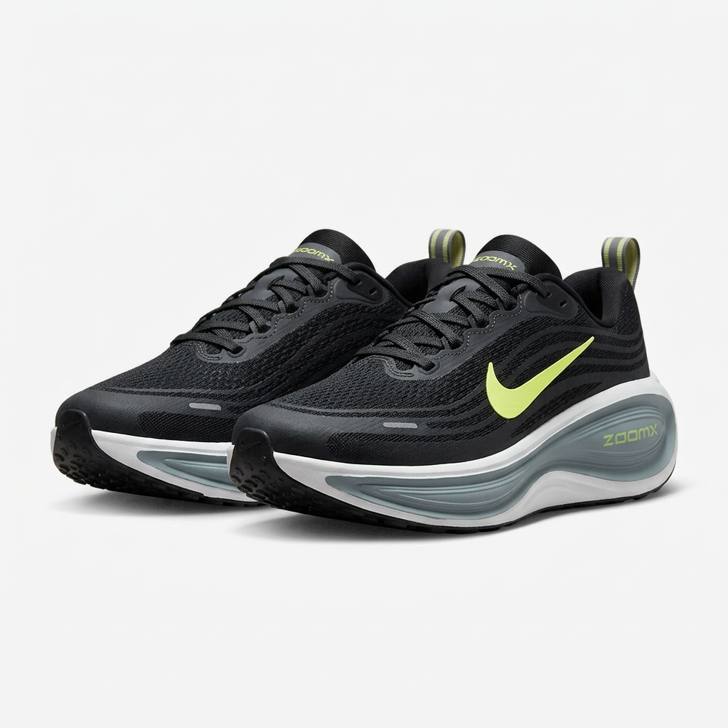 Pair of black lace-up sneakers with lime side details and grey-and-white soles